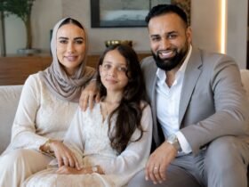 Emily Abraham and Adam Abraham, founders of Love Luxury, sitting with their daughter Maali "Moo" Abraham.