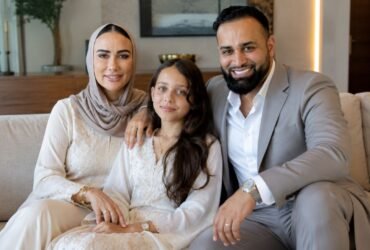 Emily Abraham and Adam Abraham, founders of Love Luxury, sitting with their daughter Maali "Moo" Abraham.