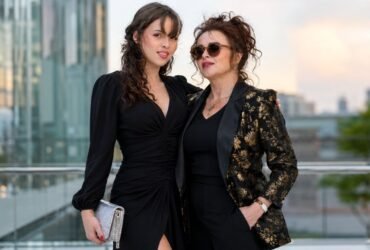 British actress Helena Bonham Carter standing alongside her daughter Nell Burton at a public event.