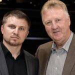 NBA legend Larry Bird standing alongside his adopted son, Connor Bird.