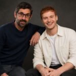 Documentary filmmaker Louis Theroux sitting next to Frederick Theroux .