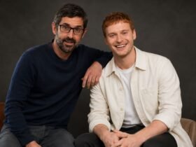 Documentary filmmaker Louis Theroux sitting next to Frederick Theroux .