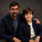 An AI-generated representation of documentary filmmaker Louis Theroux sitting with a Walter Theroux.
