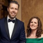 Paddy Considine and his wife Shelley Considine standing together in formal attire.