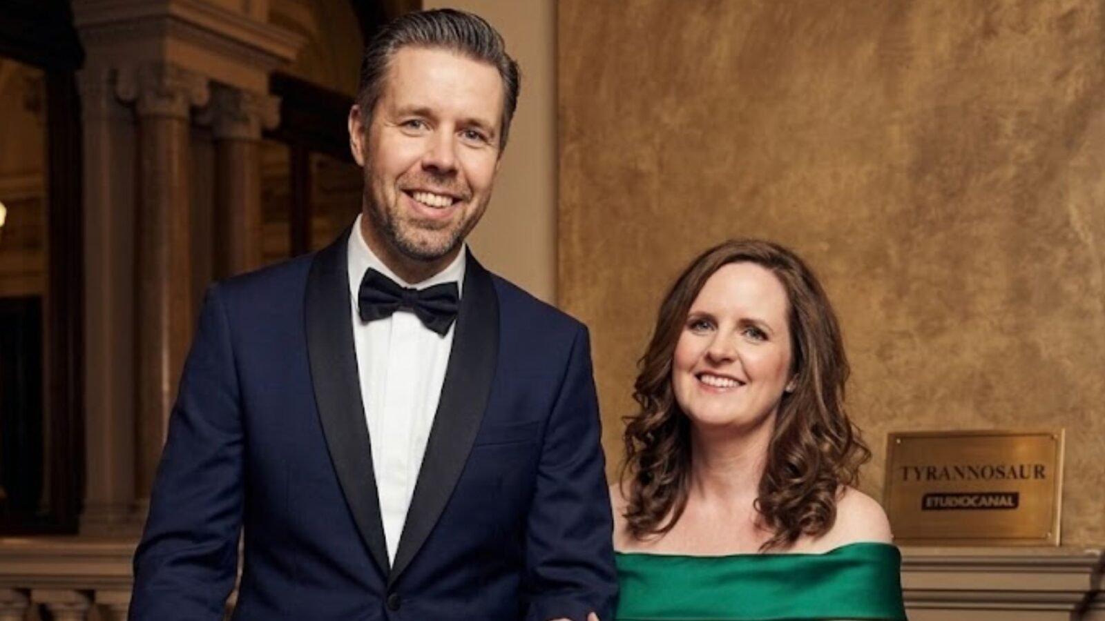 Paddy Considine and his wife Shelley Considine standing together in formal attire.