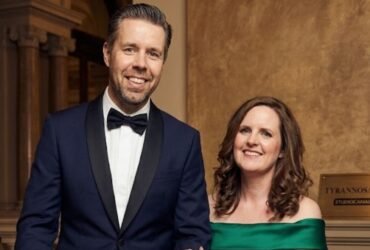 Paddy Considine and his wife Shelley Considine standing together in formal attire.