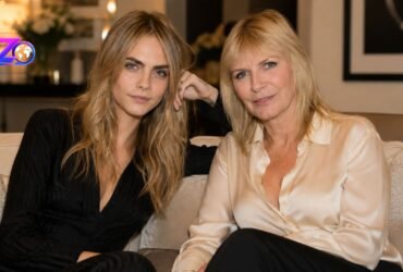 Cara Delevingne and her mother Pandora Delevingne sitting together on a sofa.