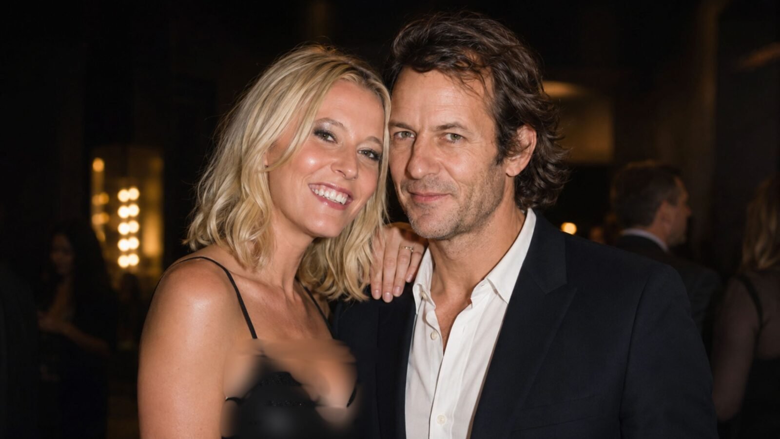 British businessman Robie Uniacke posing closely with his partner, actress Lady Emma Howard , at a public evening event.