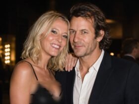 British businessman Robie Uniacke posing closely with his partner, actress Lady Emma Howard , at a public evening event.
