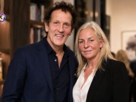 Monty Don and his wife Sarah Don standing together and smiling at an event.