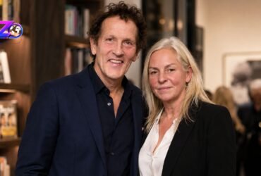 Monty Don and his wife Sarah Don standing together and smiling at an event.