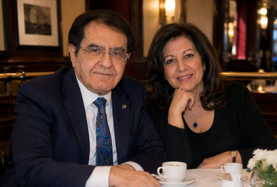 Dr. Younan Nowzaradan and his former wife Delores Nowzaradan sitting together at a restaurant table.