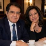 Dr. Younan Nowzaradan and his former wife Delores Nowzaradan sitting together at a restaurant table.