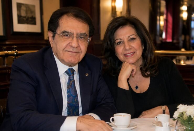 Dr. Younan Nowzaradan and his former wife Delores Nowzaradan sitting together at a restaurant table.